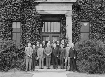 A group of VIPs, including Orville Wright, center. Left to right bottom row ?, Walter Reiser, Elton Miller, Orville Wrig