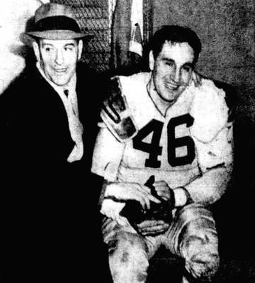 Cleveland Browns head coach Paul Brown (left) congratulates placekicker Lou Groza (right), who scored a game winning fie