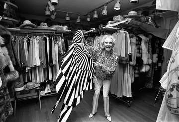 Comedian Phyllis Diller surveying her wardrobe in her 18 by 30 feet (5.5 by 9.1 m) closet
