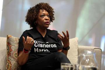 Rita Dove speaking with attendees at an event titled "Legacies: A Conversation with Sandra Cisneros, Rita Dove and Joy H