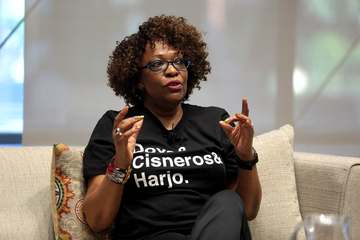 Rita Dove speaking with attendees at an event titled "Legacies: A Conversation with Sandra Cisneros, Rita Dove and Joy H