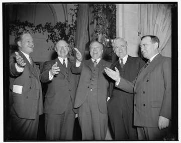 Republicans gathered for a dinner in Washington, D.C., April 20, 1939. These men are giving a salute to 1940, when they 