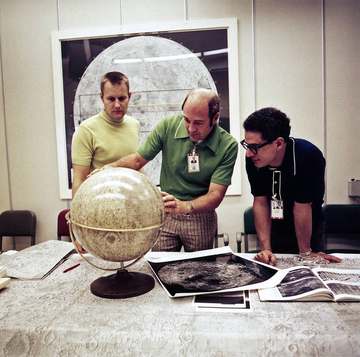 Apollo 17 Command Module Pilot Ronald E. Evans, center, receives lunar orbital geology instruction from geologist Farouk