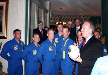 Dallas, Texas (Apr. 1, 2005) - Dallas Cowboy football legend, Roger Starbach, presents the members of the U.S. Navy Flig