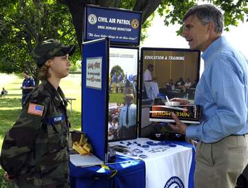 Dr. Ronald M. Sega, Under Secretary of the Air Force speaks with Virginia Civil Air Patrol cadet Airman Basic Rachel Peg