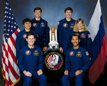Five NASA astronauts and a Russian Cosmonaut take a break from training for their scheduled flight in space to pose for 