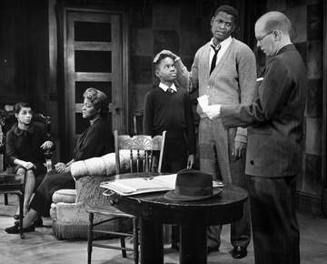 Photo of a scene from the play A Raisin in the Sun. From left-Ruby Dee (Ruth Younger), Claudia McNeil (Lena Younger), Gl
