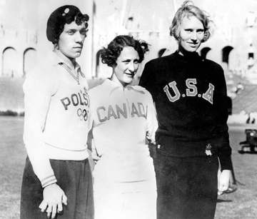 Canada's Hilda Strike (centre) celebrates her silver medal win in the women's 100m event at the 1932 Los Angeles Olympic