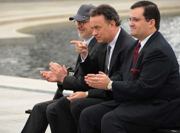 Actor Tom Hanks, center, points to 250 veterans at the World War II Memorial March 11, during a speech by HBO co-preside