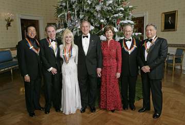President George W. Bush and Mrs. Laura Bush stand with the Kennedy Center honorees in the Blue Room of the White House