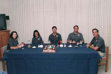 The STS-70 astronauts enjoy an early morning breakfast in the Operations and Checkout building, prior to suiting up and 