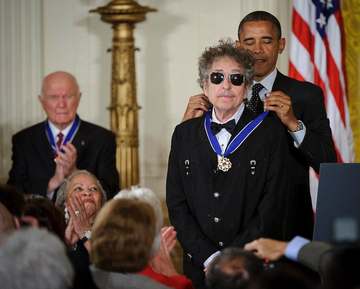 President Barack Obama presents American musician Bob Dylan with a Medal of Freedom, Tuesday, May 29, 2012, during a cer
