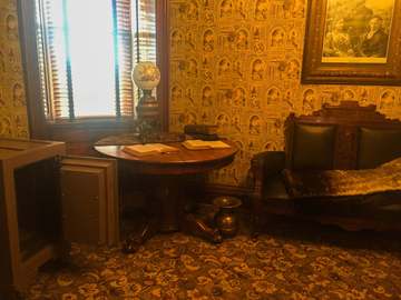 Room decorated with sofa, table, papers, globe and photograph First Ladies National Historic Site Keywords: First Ladies