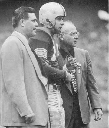 Photograph of Ohio State football coach Woody Hayes with fullback Dick Doyle and assistant coach Ernie Godfrey